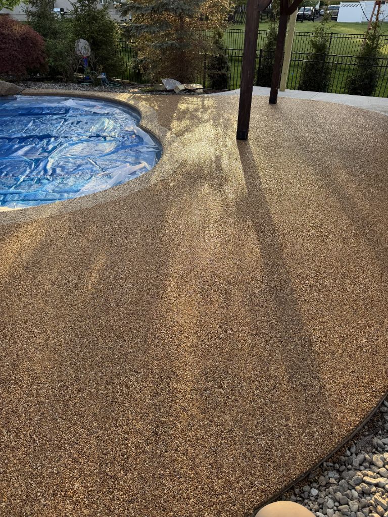 Pool deck river rock aggregate coating wide view, Central NJ